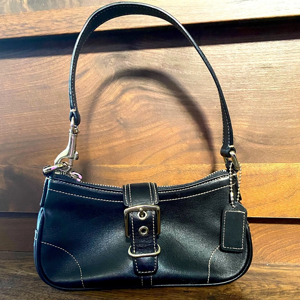 Coach, small, black leather purse. Top handle, zipper closure. Great condition.